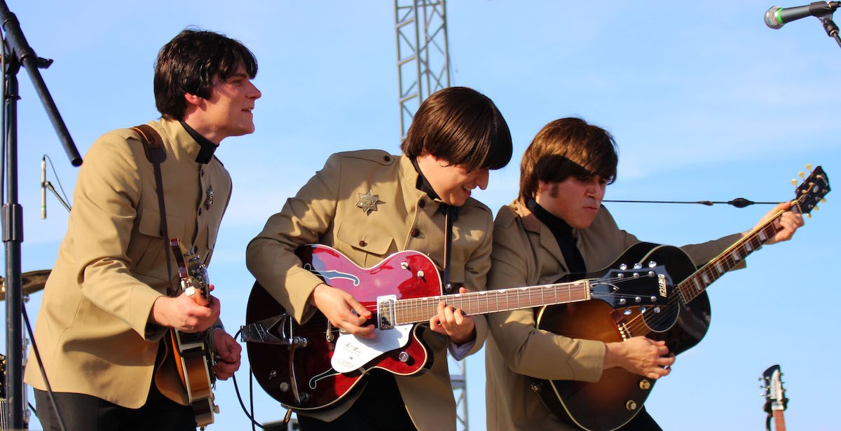 A Beatles cover band performs during Penny Lane at the Park, part of Abbey Road on the River, in 2021.