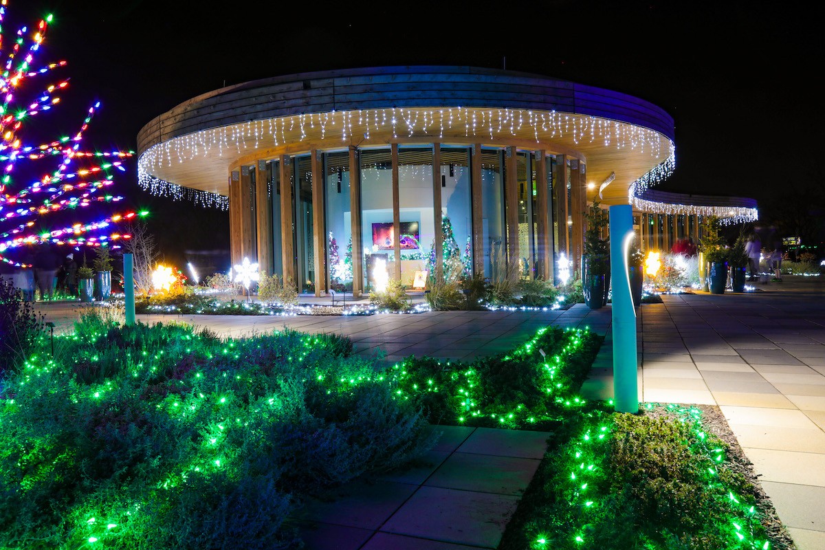 Gardens Aglimmer is a winter wonderland filled with light bursts, candles and a multicolored tunnel of light.