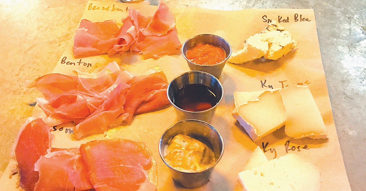 Garage Bar's Ham Tasting plate; from top to bottom, the hams are Broadbent, Benton's and col Newsom's. The cheeses, from top to bottom, are Mimi's smoked bleu, Old Kentucky Tomme and Kenny's Kentucky Rose. And the pairing is a pour of Peerless Rye