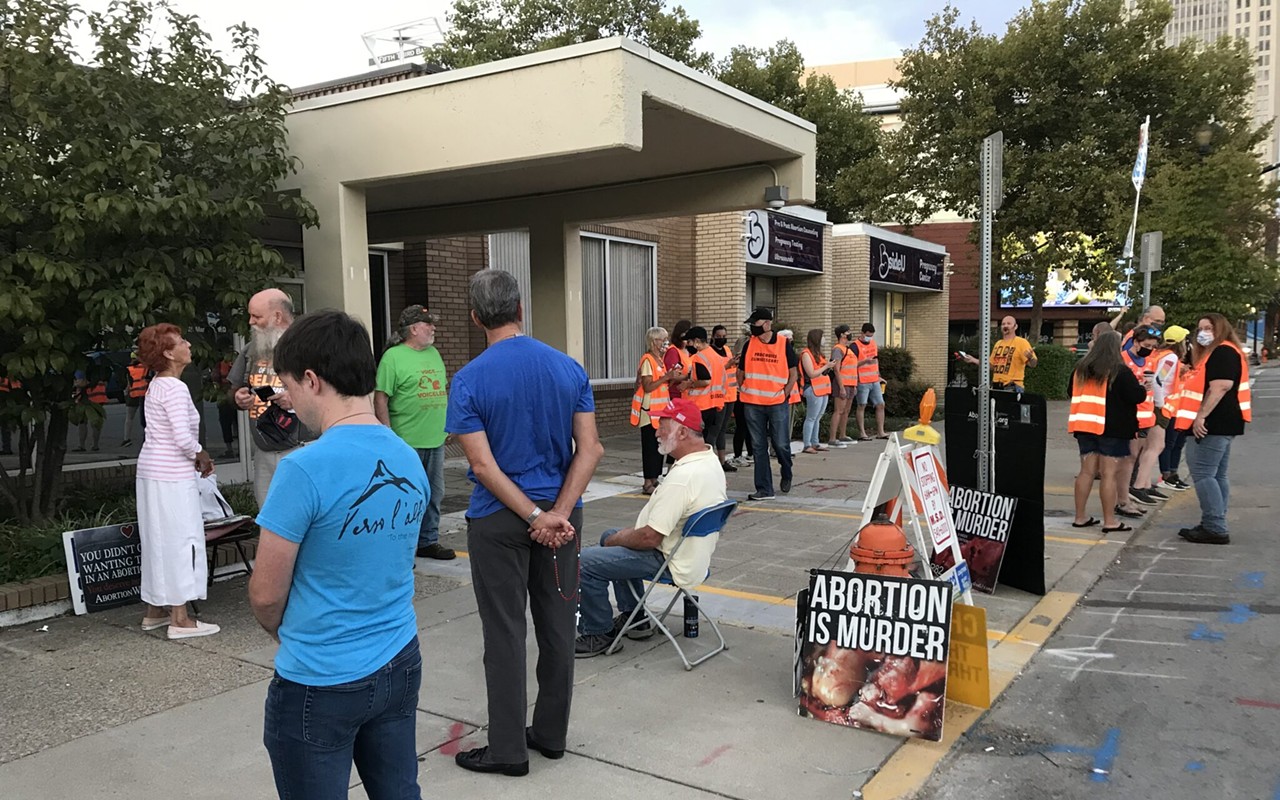 Prior to the abortion ban, volunteer escorts in orange vests waited outside EMW Women&#146;s Surgical Center to help patients get past anti-abortion protesters who regularly gathered at the clinic.