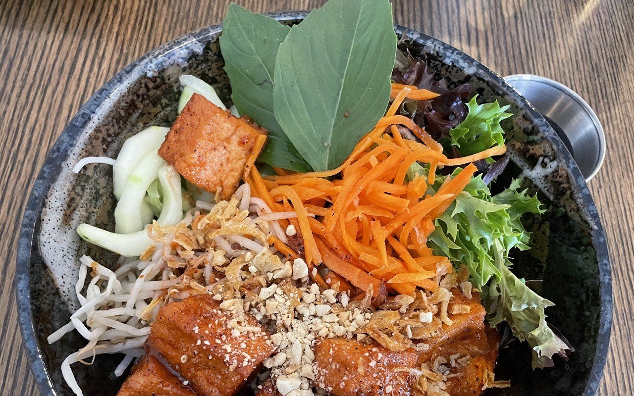 Bun thit nuong, a hearty South Vietnamese rice-noodle dish, is available with tofu (pictured) or, in its traditional form, grilled pork loin, tossed with salad fixings and crushed peanuts.
