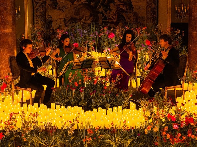 The renowned candle-lit musical experience’s visual splendor will be accentuated by the addition of thousands of flowers in an ode to the Spring season.
