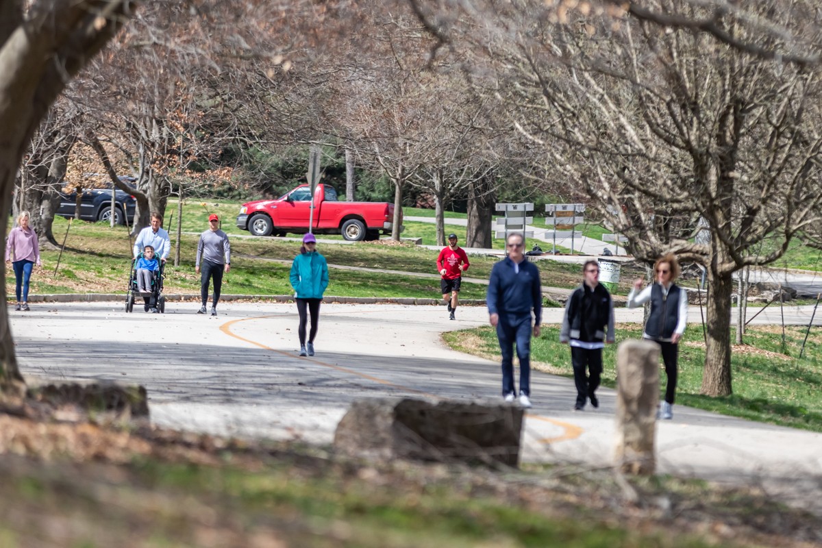 Pedestrians using both sides of the road on the Scenic Loop in Cherokee Park when it was closed to traffic.  |  Photo by Kathryn Harrington.