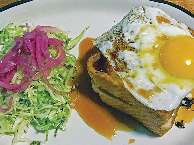 Grilled cheese sandwich topped with a fried egg at Portage House