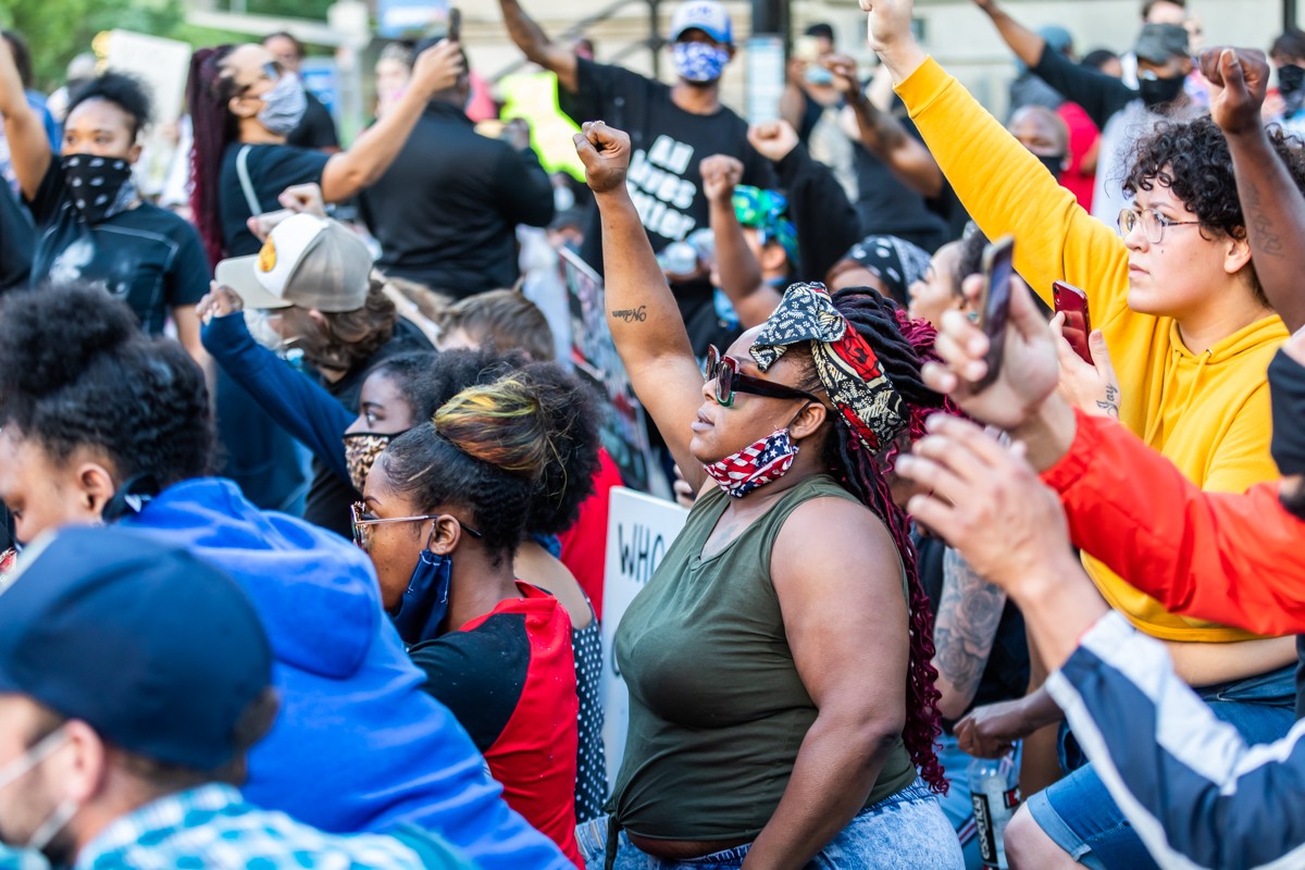 Protesters raised their fists in solidarity during the Breonna Taylor protests last year.