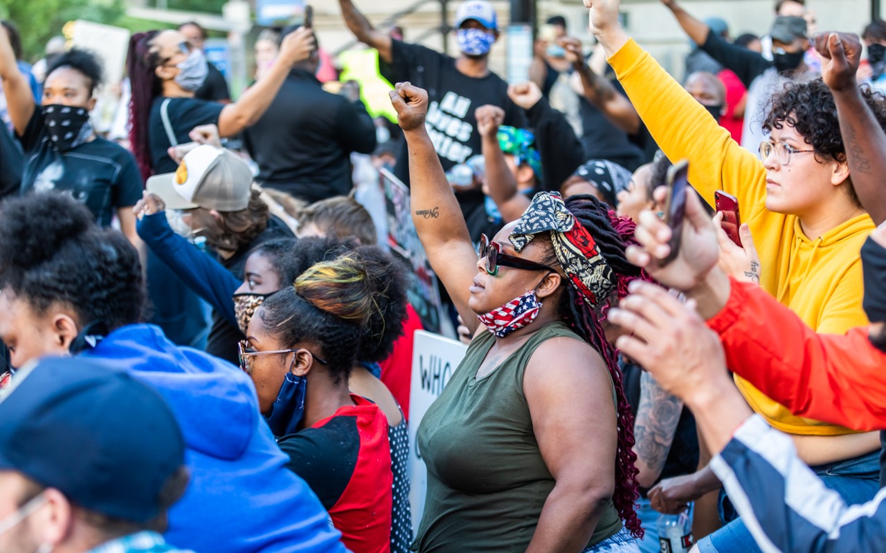 Protesters raised their fists in solidarity during the Breonna Taylor protests last year.
