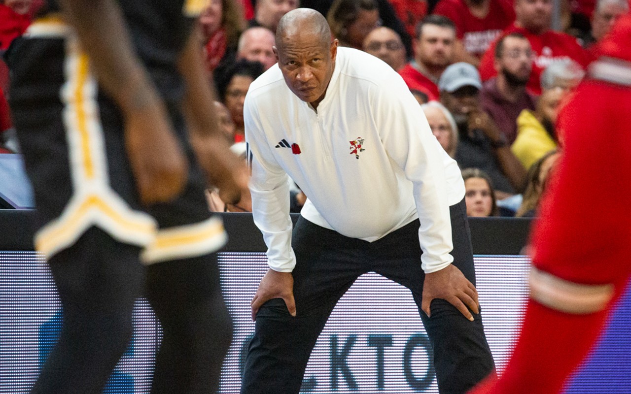 Coach Kenny Payne watches the UofL vs. UMBC men's basketball game at the KFC Yum! Center on Nov. 6, 2023.