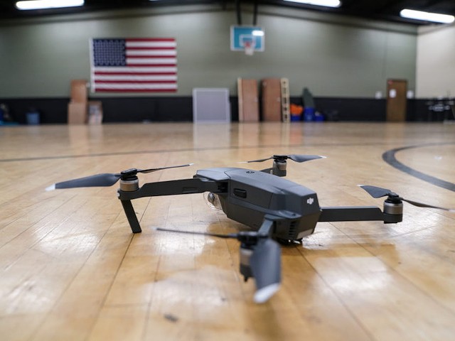 A Jeffersontown Police officer demonstrates flying the department's DJI Mavic Pro drone in the police department gym. He asked not to be identified because he does undercover work  |  Photo: J. Tyler Franklin