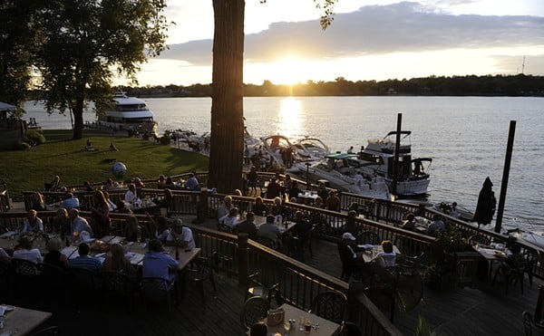 Summer sunset seen from the popular riverside alfresco terraces at Captain's Quarters.