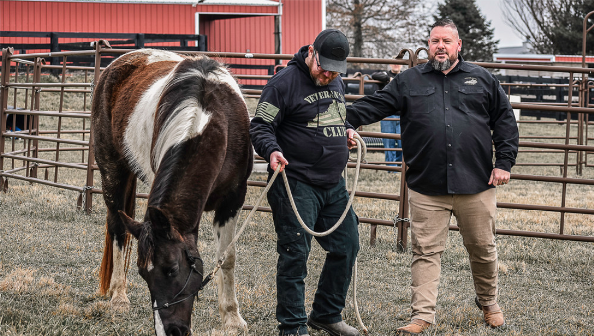 Kentucky Army combat veteran Jeremy Harrell (right) founded Veteran&#146;s Club, based in the Louisville area, and advocates for mental health through a variety of organizations. Among other programs, The Veteran&#146;s Club runs an Equine Facilitated Mentoring program to help veterans with PTSD and traumatic brain injuries. Pictured: Harrell with Don Hoy, USMC veteran.