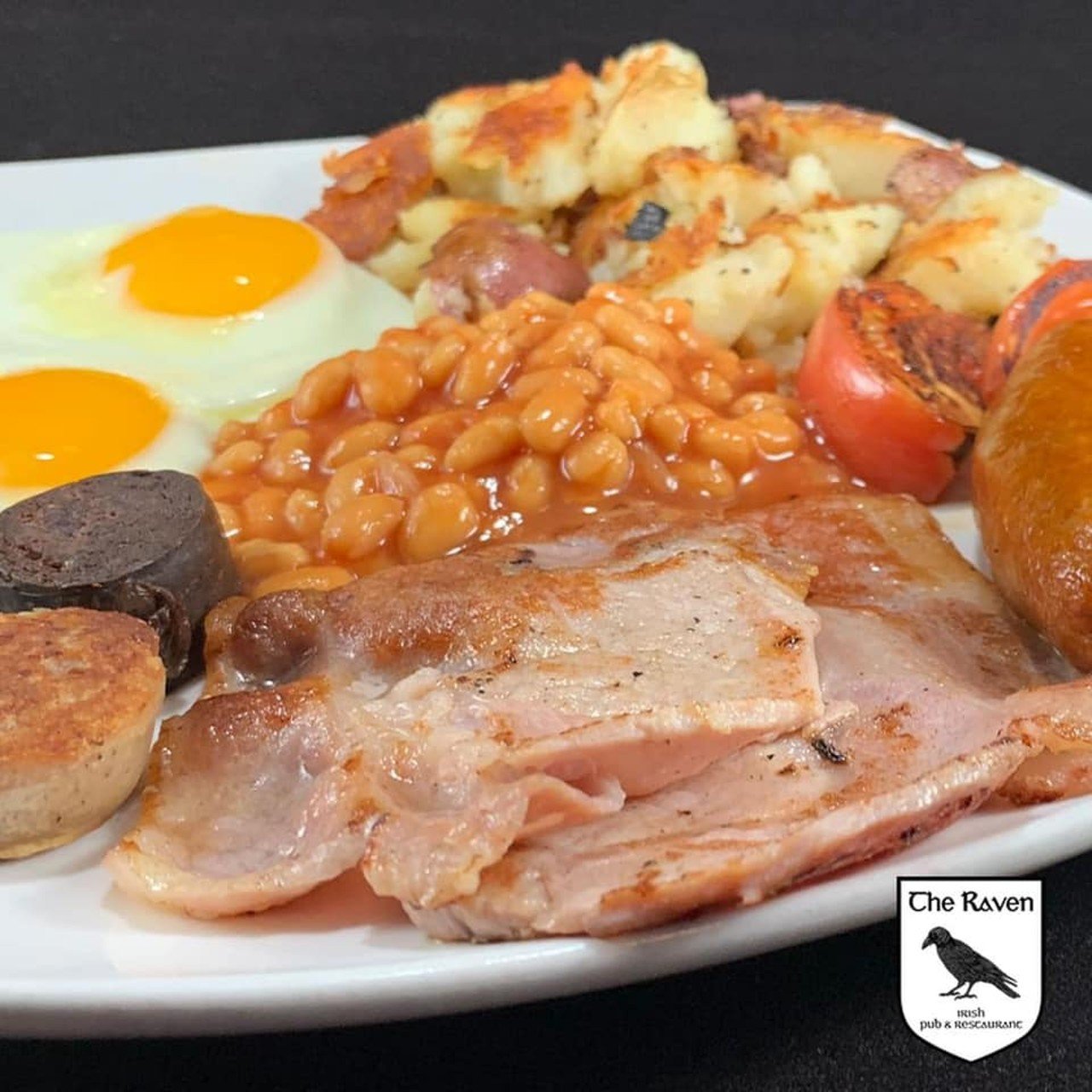 The Raven Irish Pub
3900 Shelbyville Road
The recently renovated Raven in St. Matthews offers a classic Irish breakfast.
Featured in the photo is The Full Irish &#150; Two eggs to order, with bangers, rashers, black and white pudding. Served with grilled tomato, baked beans, fried red potatoes and your choice of toast or muffin.
