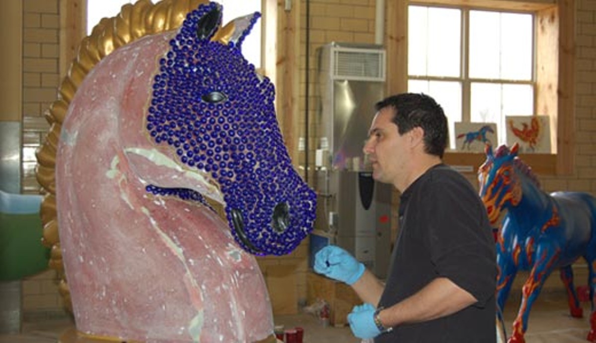 Artist Fred Ruffenach works on a horse for Leadership Louisville.