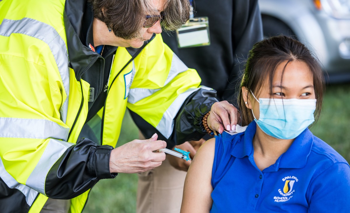 Director of the Pre-licensure BSN program at Spalding University Dr. Nancy Kern administered the Covid vaccine to Hsel Meh at the Mayor&#146;s Hike, Bike and Paddle.