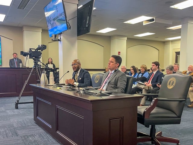 Corrie Shull, the chairman of the JCPS Board of Education, left, speaks as Superintendent Marty Pollio listens during a Kentucky House Education Committee meeting at the Capitol in Frankfort, March 5, 2024.