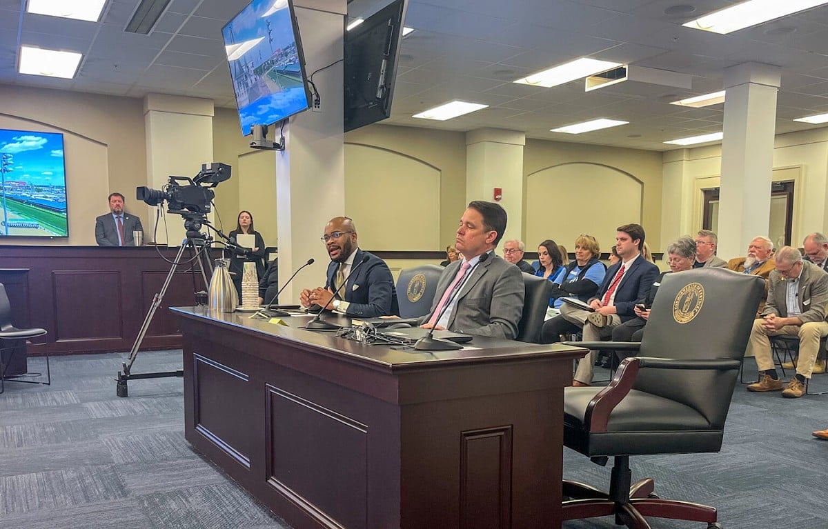 Corrie Shull, the chairman of the JCPS Board of Education, left, speaks as Superintendent Marty Pollio listens during a Kentucky House Education Committee meeting at the Capitol in Frankfort, March 5, 2024.