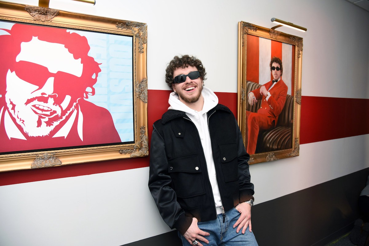 During Jack Harlow's visit to KFC headquarters, he posed with his portraits in the hallways, created to celebrate his partnership with the brand.