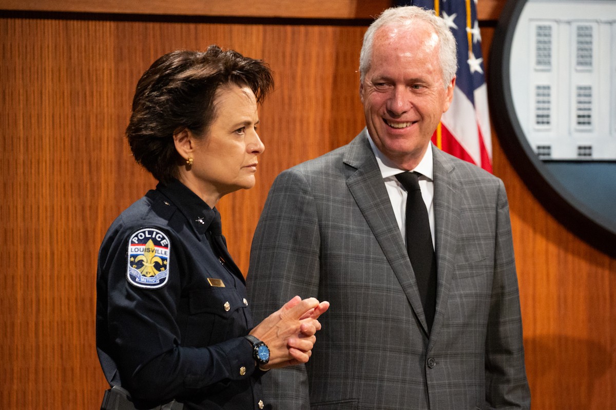 LMPD Chief Erika Shields and Louisville Mayor Greg Fischer at a police academy graduation on
    Sept. 12.