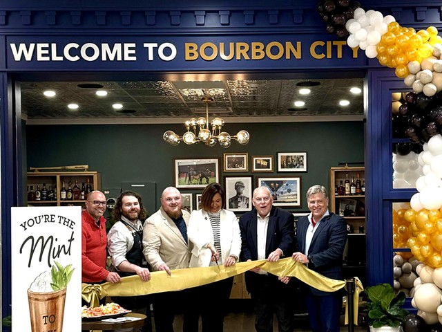 Members of Louisville Tourism cut the ribbon on the airport’s newest resource center.