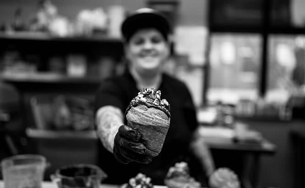 Pastry Chef Amanda Johnson shows off one of her creations. We're not drooling, you are.