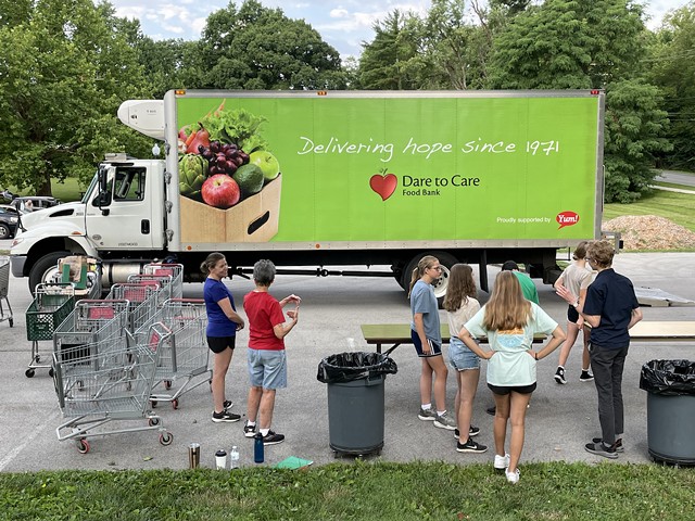 Green as a head of ripe broccoli, Dare To Care Food Bank's truck makes the round of area food pantries with groceries to share with those who need help.