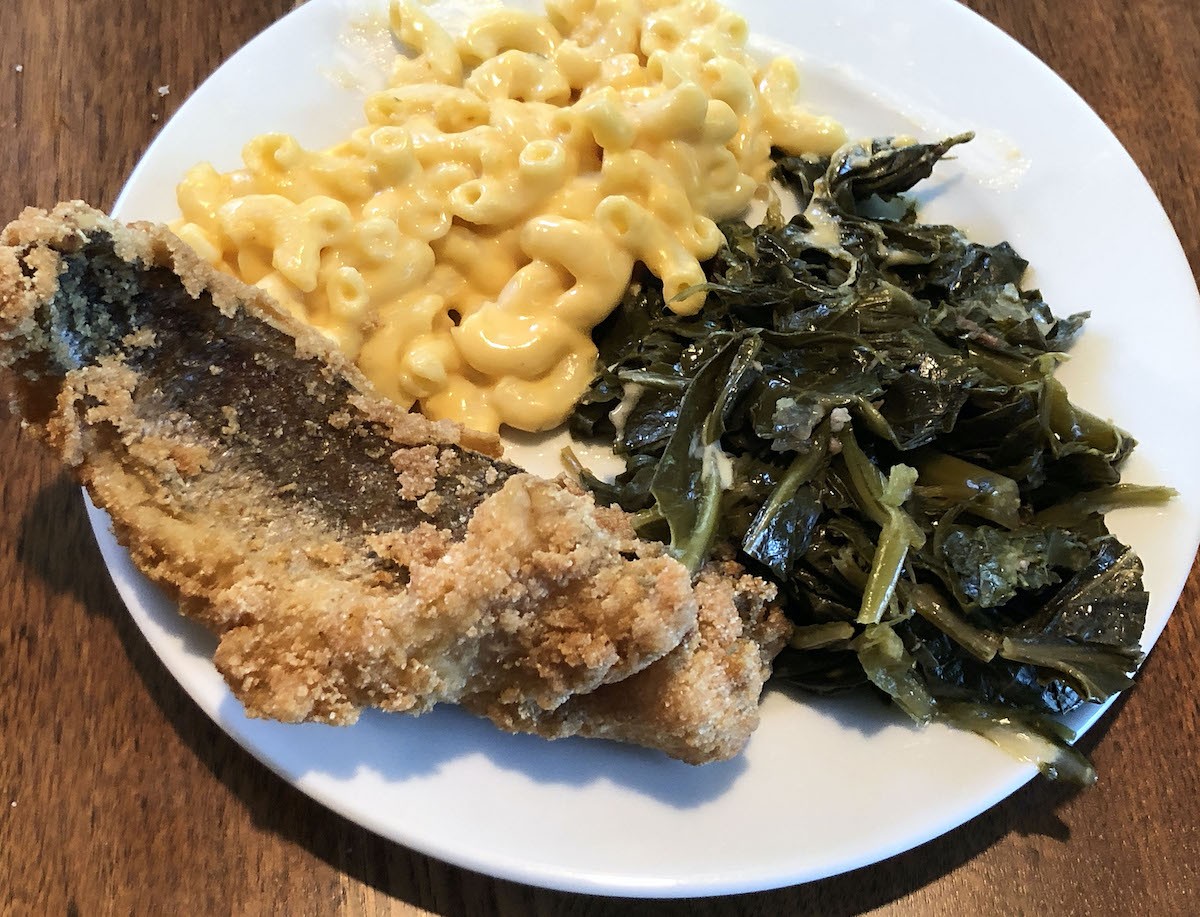 Plated to enjoy at home, LuCretia&#146;s boneless whiting fillets are fried crisp, flaky and perfectly cooked. They were served with excellent greens, macaroni and cheese and a block of cornbread.  |  Photos by Robin Garr.