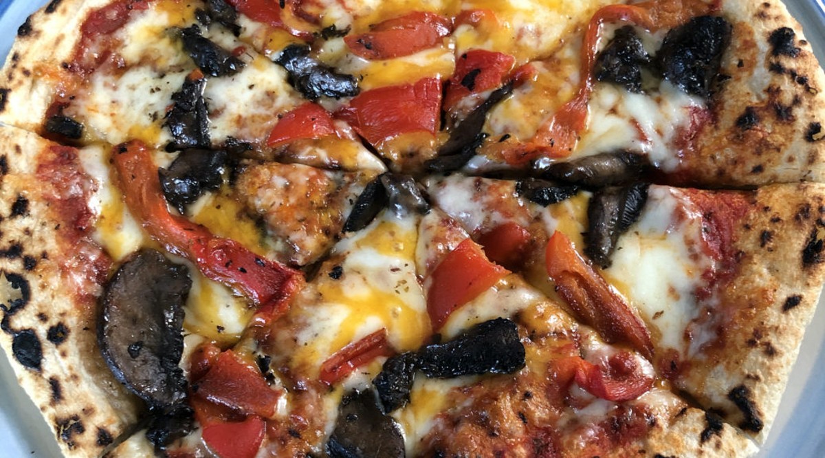MozzaPi&#146;s cheese pizza with roasted red peppers and mushrooms.