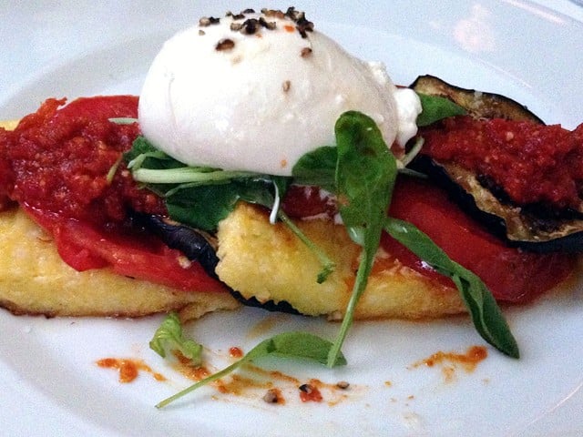 Polenta Pave at Jack Fry's: Thin layers of tomato, roasted eggplant and sun-dried tomato jam stacked on slabs of smooth yellow-corn polenta and topped with an oval of creamy, rich burrata cheese. Photo from a 2014 review.