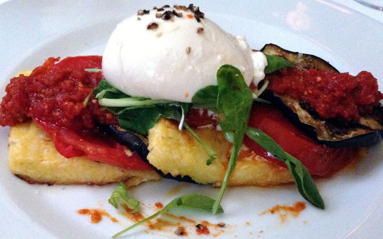 Polenta Pave at Jack Fry's: Thin layers of tomato, roasted eggplant and sun-dried tomato jam stacked on slabs of smooth yellow-corn polenta and topped with an oval of creamy, rich burrata cheese. Photo from a 2014 review.