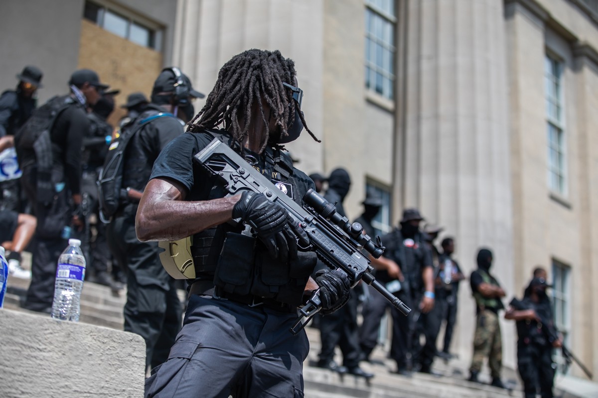 Members of the Black militia group all dressed in black, and all were armed.