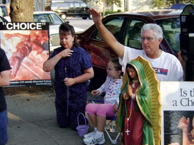 Pro-life protestors gather outside Louisville's only abortion clinic.