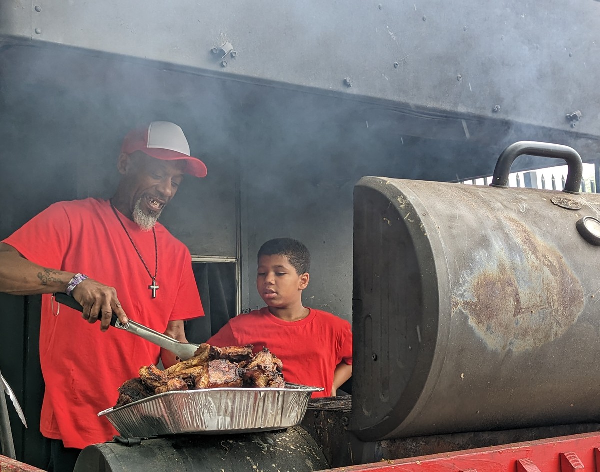 Andre Gore of Gore's SmokeOut BBQ at 516B S. 18th St. with his grandson, provided by OneWest