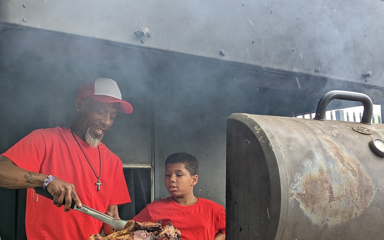 Andre Gore of Gore's SmokeOut BBQ at 516B S. 18th St. with his grandson, provided by OneWest