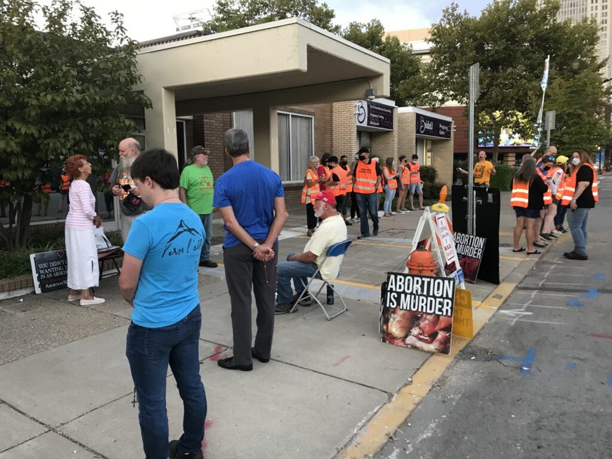 Protesters and safety escorts for patients gathered last year outside EMW Women&#146;s Surgical Center in Louisville. (Photo by Deborah Yetter)