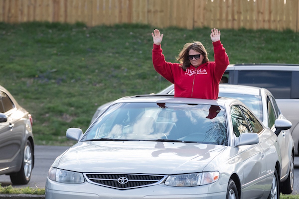 Some parishioners open their sunroofs to worship at On Fire Christian Church's service on sunday evening.