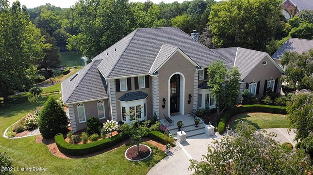PHOTOS: This Manor Has A Lake With Two Waterfalls In The Backyard