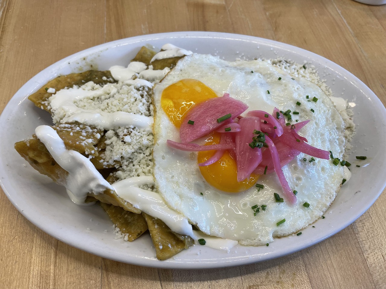 Con Huevos
2125 Hurstbourne Parkway, 10639 Meeting St., 2339 Frankfort Ave., 4938 US Highway 42, 210 W. Liberty St.
Review: Recommended: Con Huevos, A Louisville Favorite For Breakfast Or Lunch
Recommended: "I often get huevos rancheros ($13.99) here, but for a change of pace decided to fill up on a hearty ration of chilaquiles ($13.99, or $4 for a small side dish). This classic Mexican dish, according to tradition, traces its roots to the Aztecs. It comes in many regional variations, but Con Huevos&#146; version is typical: Corn tortillas are cut into quarters and cooked in a bath of spicy salsa verde until they soften. Then, this comfortable bed becomes a home for two bright sunny-side-up eggs; grated queso fresco cheese; stripes of tangy crema; crisp, pink pickled onions; and snipped chives. It&#146;s quite a hefty combination, and I have to stop and think about how best to eat it &#150; usually a mix of fork, knife, and fingers &#150; but all the disparate flavors come together in an appetizing mix.&#148;