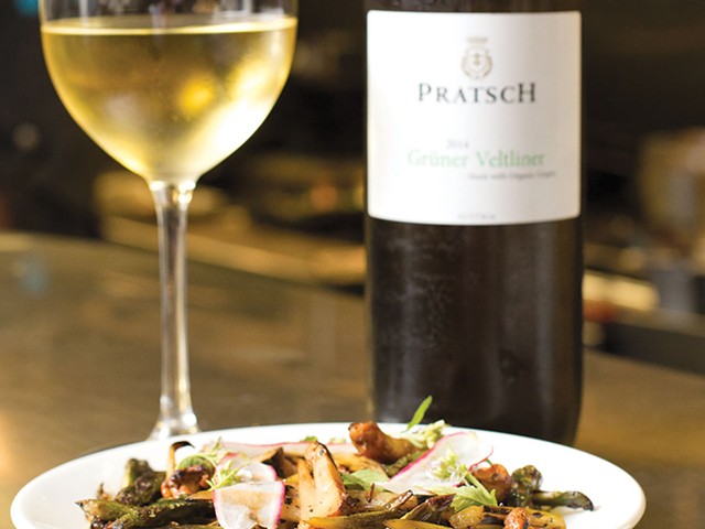 Charred asparagus, with chanterelles, arugula blossoms and  and roasted jalape&ntilde;o salsa verde, paired with a glass of Pratsch 2014 Gruner Veltliner at the Butchertown Grocery
