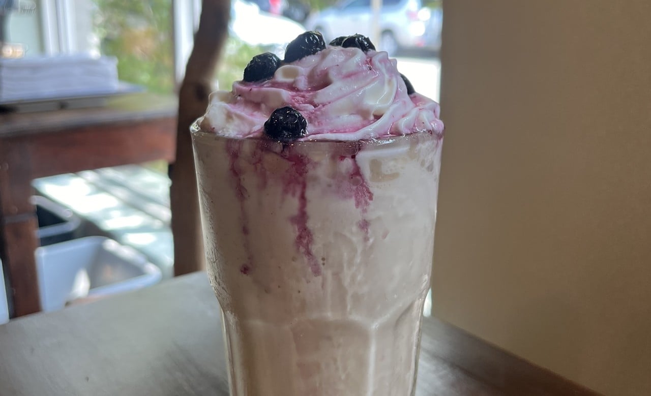 Blueberry Pie LatteSafai CoffeeFrozen spiced brown sugar latte, topped with whip cream and house blueberry pie filling.