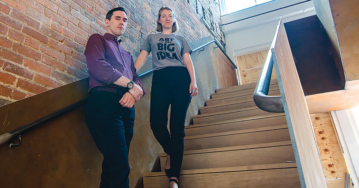 Associate Curator Joey Yates and Communications Manager Emily Miles on KMAC's new staircase. (photo by Nik Vechery)