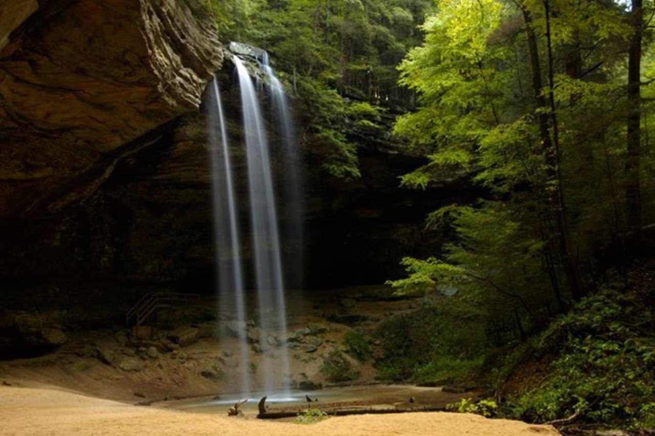 Hocking Hills State Park
Distance: 3 hours, 50 minutes
Hocking Hills State Park has five different sections within the 9,000+ acres of land to explore. Millions of guests embrace the forest year-round by hiking, rock climbing, canoeing and camping on one of the 200 campsites in the area. A must-see is Ash Cave, an out-of-this-world rock formation that just so happens to be the biggest recess cave in the state.
Photo via facebook.com/HockingHillsStatePark