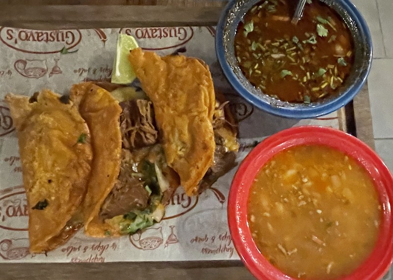 Birria is like a turbo-powered taco. Gustavo's tasty version is made with long-marinated and simmered Angus beef, chiles, and spices packed into marinated and fried corn tortillas to maximize its flavor. - Photos by Robin Garr