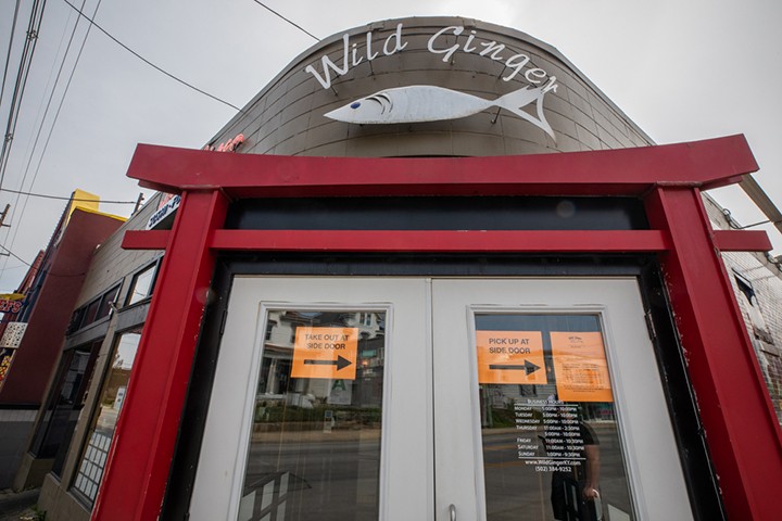 The sign at Wild Ginger directs its customers arriving for takeout orders. - KATHRYN HARRINGTON