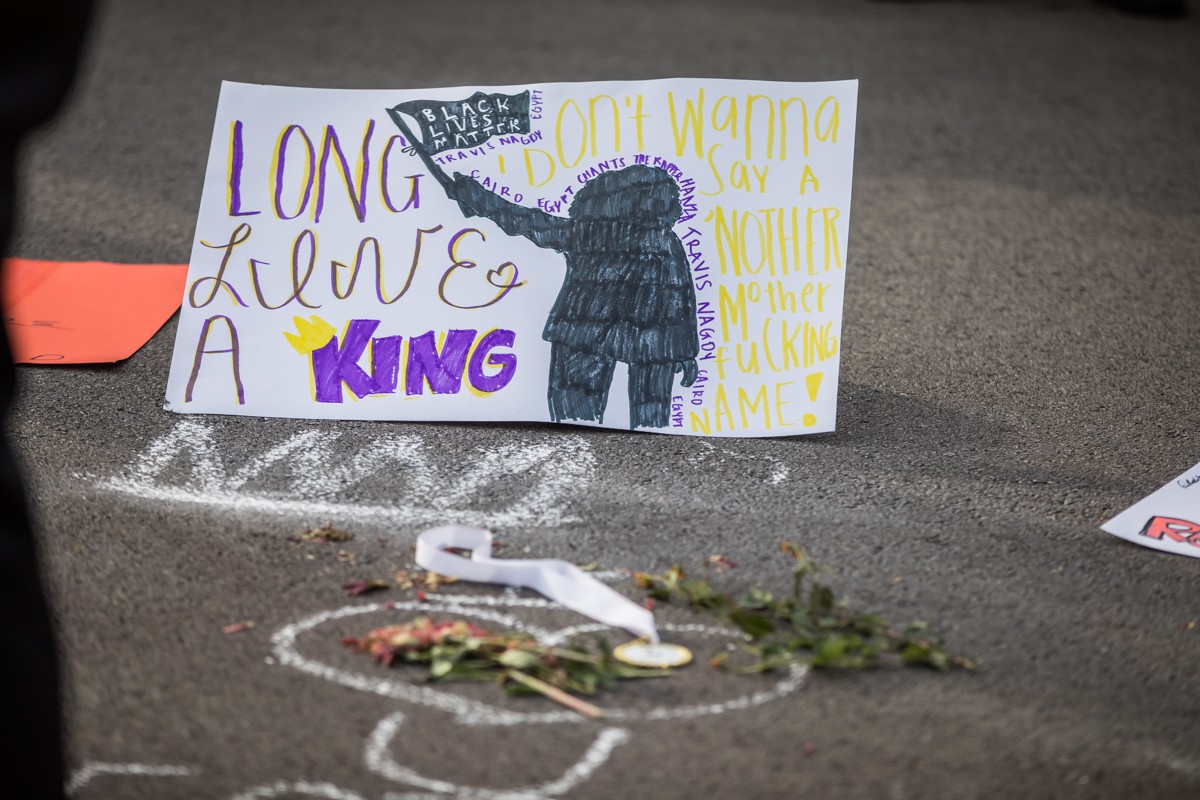 Posters and photos were placed in the street on Crittenden Drive where social justice activist Travis Nagdy died from a gunshot wound on Monday. - KATHRYN HARRINGTON
