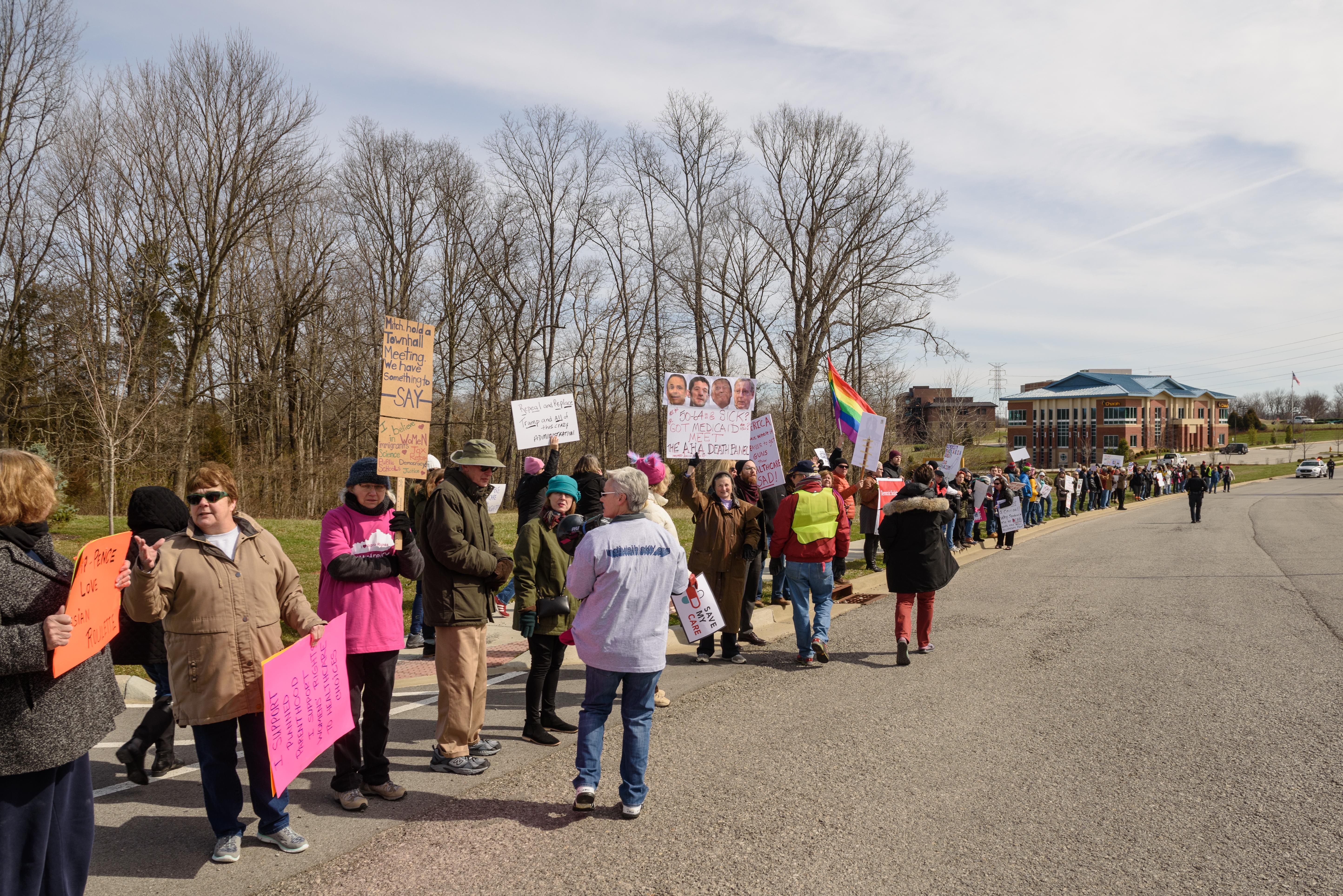 Protest organizers stretch their line from the corner at Tucker Station Road along Plantside Drive closer to where Vice President Pence is speaking. - BRIAN BOHANNON