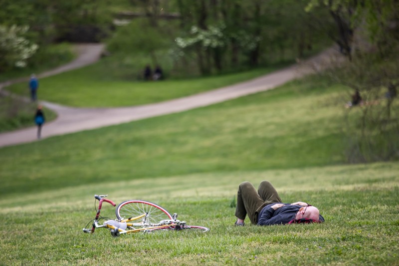 A cyclist takes a break in Cherokee Park. - Photo by Kathryn Harrington