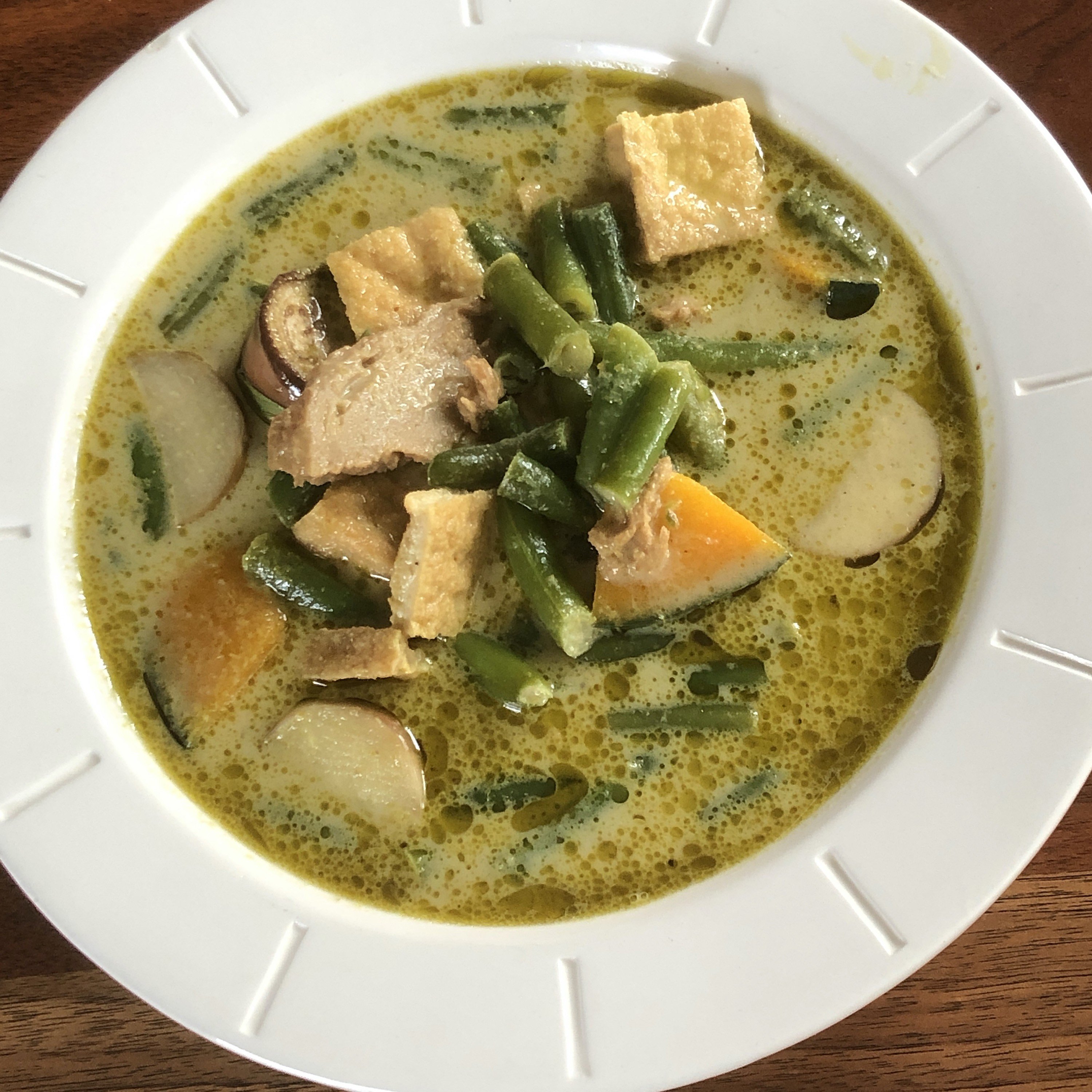 Thai Cafe&#146;s green curry is loaded with crisp-tender vegetables and your choice of meat, tofu or wheat-based mock chicken in a coconut milk broth that&#146;s spicy enough to get your attention.