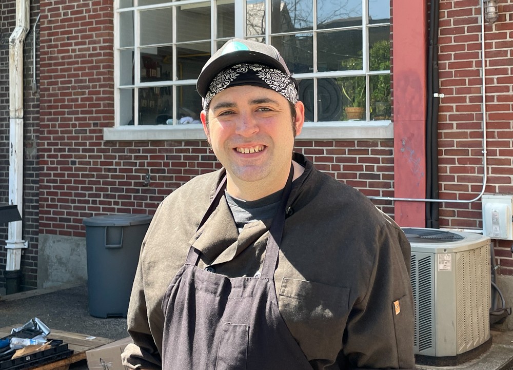 Feed Louisville sous chef Sean FitzGerald takes a fresh-air break outside Feed Louisville's busy kitchen.