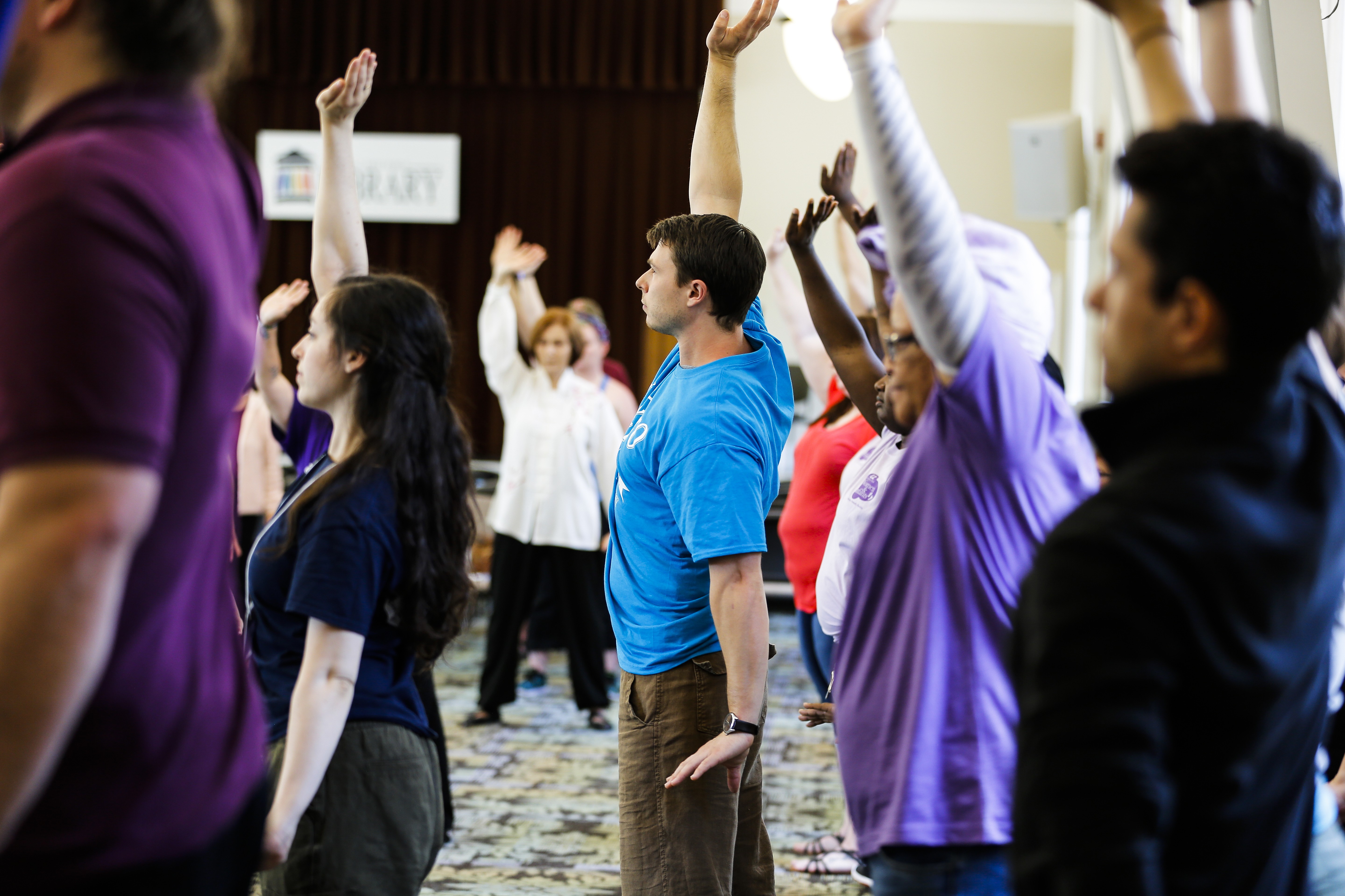 Festival goers practice their Tai Chi while attending one of the many programs at the Louisville Free Public Library&#146;s How-To Fest.