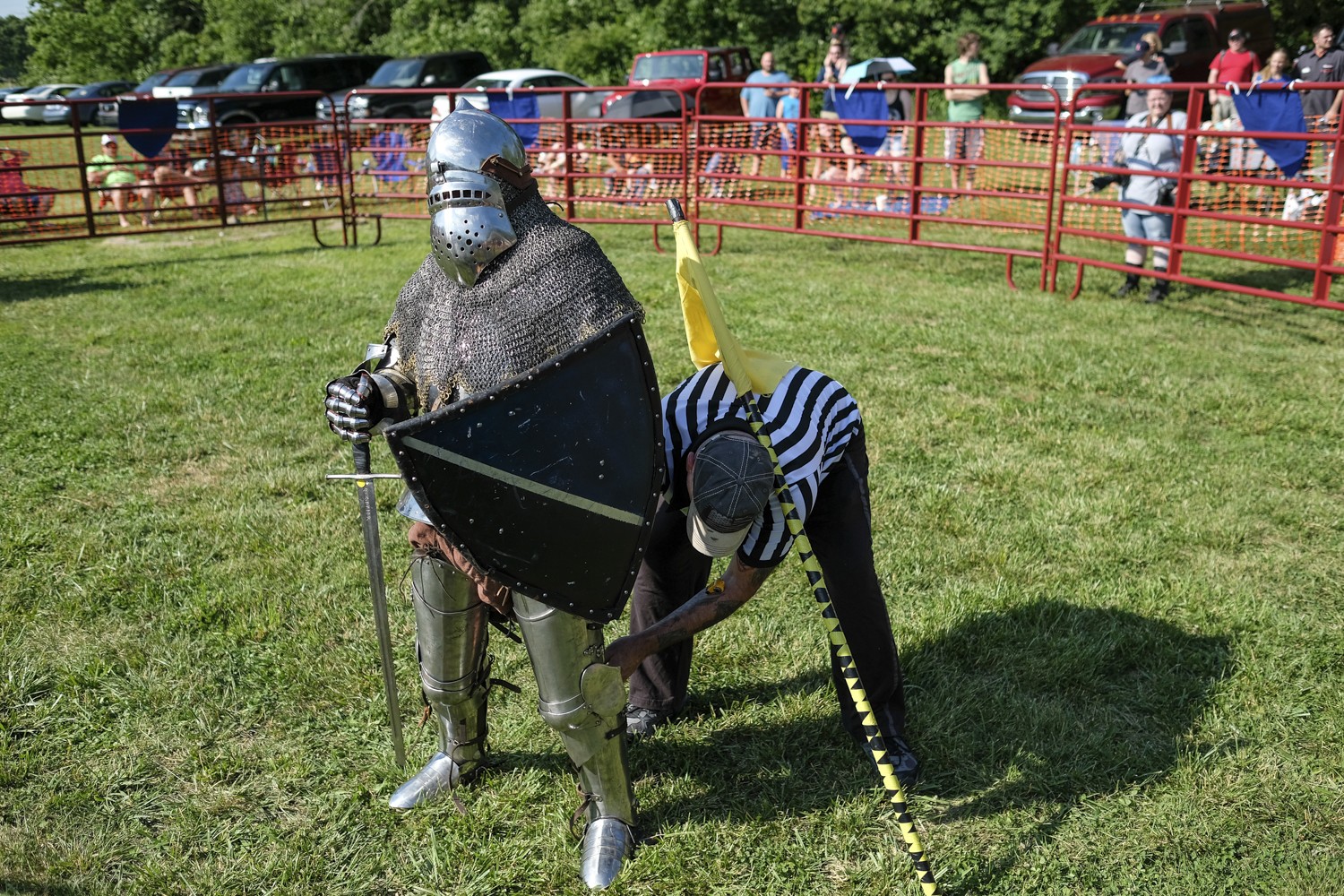 The referee checks a knight&#146;s armor between rounds.