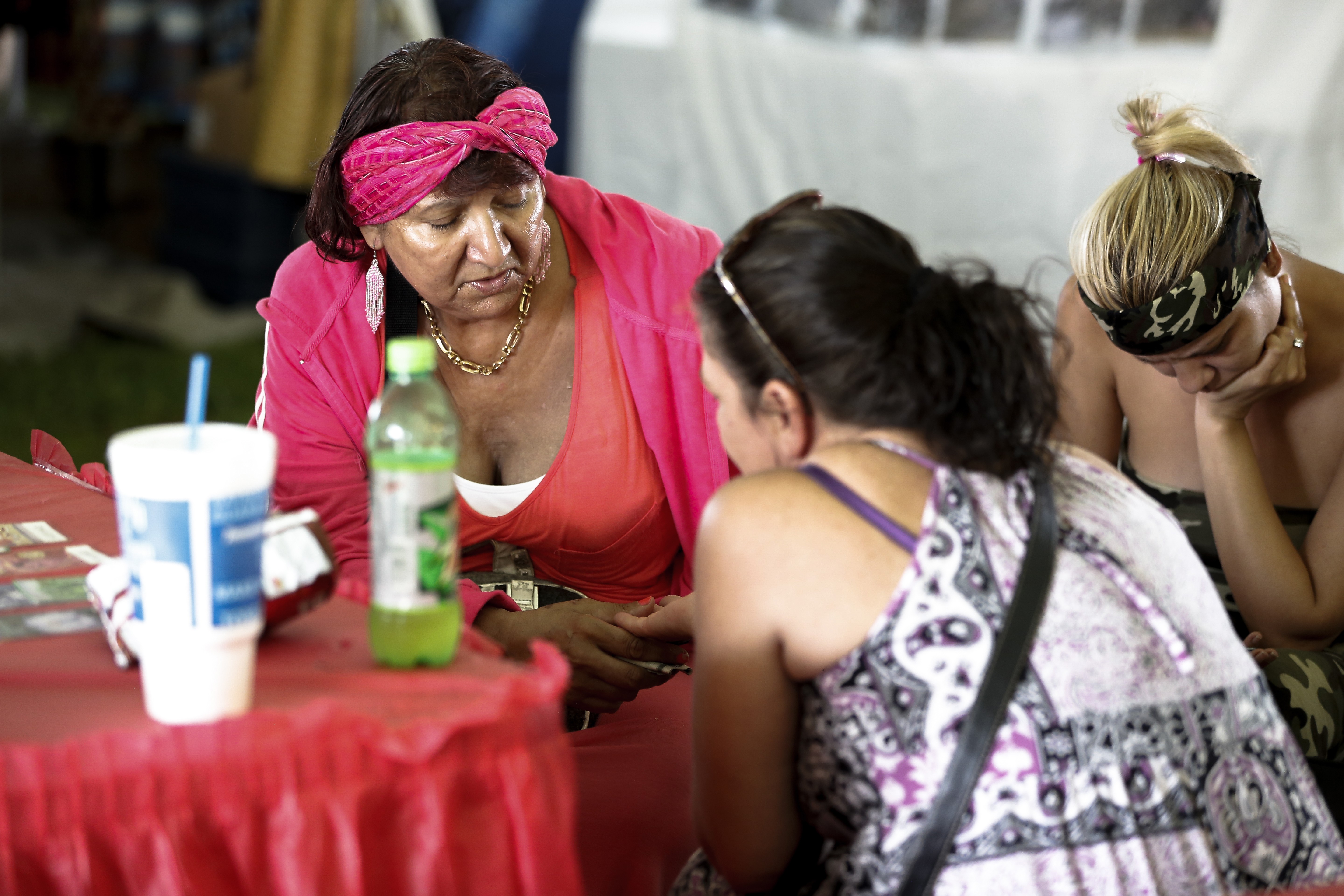 A festival goer gets her palm read.